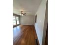 Spacious living room featuring hardwood floors and large window at 1098 Laurel Nw Ln, Conyers, GA 30012