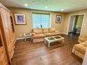 Cozy living room featuring hardwood floors and a large window for natural light at 1280 Sanden Ferry Dr, Decatur, GA 30033