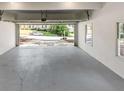 Garage with finished gray floor and view to the street at 1420 Fieldgreen Overlook, Stone Mountain, GA 30088