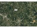 A satellite view of the property location in Oxford, GA, surrounded by greenery at 5711 Hill View Dr, Oxford, GA 30054