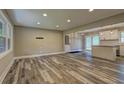 Spacious living room featuring stylish wood flooring and recessed lighting at 1675 Bouldercliff Se Ct, Atlanta, GA 30316