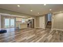 Open floor plan connecting the living room and kitchen with stainless steel appliances at 1675 Bouldercliff Se Ct, Atlanta, GA 30316