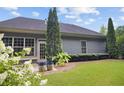 Spacious backyard featuring a well-kept lawn, mature trees, and a serene outdoor setting at 308 Shade Tree Cir, Woodstock, GA 30188