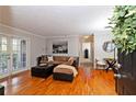 Hardwood floors, lots of light, and a cozy sectional make this living room very inviting at 1150 Collier Nw Rd # B5, Atlanta, GA 30318
