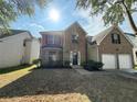 Beautiful two-story home with brick facade, bay window, and attached two-car garage at 4189 Post Oak Grv, Atlanta, GA 30349