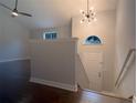 Inviting entryway featuring hardwood floors, stylish lighting, and a staircase, creating a welcoming atmosphere at 2333 Wilkins Cv, Decatur, GA 30035