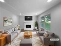 Bright living room with a cozy fireplace and neutral decor, staged with stylish furniture at 3867 Cherie Glen Rd, Snellville, GA 30039