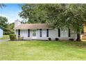 Attractive home features a well-kept lawn, trimmed shrubs, and a classic design for a welcoming curb appeal at 183 Peachtree Ct, Riverdale, GA 30274
