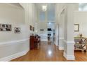 Inviting hallway with gleaming hardwood floors, high ceilings, and elegant trim work at 995 Lewis Ridge Cir, Lawrenceville, GA 30045