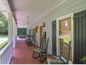 Spacious front porch with classic rocking chairs offering an inviting outdoor living space at 3743 Johnston Rd, Winston, GA 30187