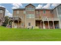 Townhome backyard featuring green grass and private wooden decks at 1160 Newpark View Pl # 8, Mableton, GA 30126