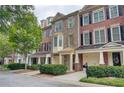 Charming brick townhomes with attached garages and covered front porches at 1160 Newpark View Pl # 8, Mableton, GA 30126