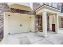 Spacious two car garage with attached pillars and front door at 1160 Newpark View Pl # 8, Mableton, GA 30126