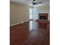 Inviting living room features hardwood floors, fireplace, and lots of natural light at 2209 Willow Crest Cir, Lawrenceville, GA 30044