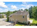 Lovely home showcasing a three-car garage and a sprawling driveway at 3843 Dragon Fly Ln, Loganville, GA 30052