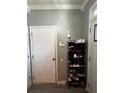 Functional entryway with a shoe rack, security system, and neutral wall color at 4018 Carisbrook Dr, Union City, GA 30291