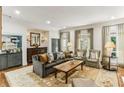 Elegant living room with hardwood floors, stylish furniture, and abundant natural light at 2466 Brookhaven Ne Pl, Brookhaven, GA 30319