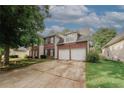 Charming two-story brick home with a spacious driveway and attached two-car garage at 1964 Cutters Mill Way, Lithonia, GA 30058