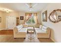 Inviting living area with a white sectional sofa and bright natural light at 12148 Flannery Ln, Hampton, GA 30228
