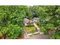 Aerial view of home surrounded by mature trees, showcasing the property's privacy at 91 Rogers Se St, Atlanta, GA 30317