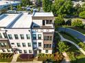 Aerial view of a modern townhome featuring lush landscaping and well-maintained surroundings at 2076 Holtz Ln, Atlanta, GA 30318