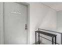 Neutral painted hallway, features a shelf and the door to unit 206 at 2240 Cheshire Bridge Ne Rd # 206, Atlanta, GA 30324