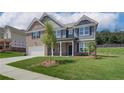 Modern two-story brick home, accented by professionally landscaped grounds, combining elegance and comfort at 1816 Kingsmere Run Dr, Loganville, GA 30052