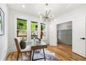 Bright home office featuring hardwood floors, stylish lighting and a view of the two-story porch at 224 Cambridge Avenue, Decatur, GA 30030
