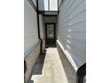 A welcoming side entrance with brick accents and a well-lit doorway at 2670 Greenbelt Rd, Snellville, GA 30078