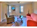A cozy living room space complete with furniture, vinyl floors, and a light colored wall at 2958 Klondike Rd, Lithonia, GA 30038