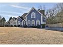 Beautiful two-story home with well-manicured lawn, complementing the traditional architectural design at 5696 Kilrush Se Ct, Mableton, GA 30126