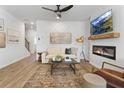 Modern living room featuring a stunning accent wall, a cozy fireplace, and an open layout great for entertaining at 229 Ivey Ter, Temple, GA 30179