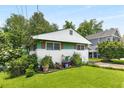 Charming home with well-maintained lawn, garden, and brick accents at 2355 Ewing Ne Dr, Brookhaven, GA 30319
