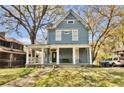 Beautiful two-story home with a welcoming front porch, classic design, and well maintained front yard at 561 Culberson Sw St, Atlanta, GA 30310