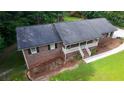 Overhead view of the brick house highlights the roof, landscaping, and outdoor space at 2202 Springdale Dr, Snellville, GA 30078