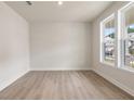 Sunlit home office or flex space with beautiful light wood flooring and large windows at 722 Crossroad Ct, Powder Springs, GA 30127