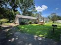 Well-kept home featuring green lawn, mature trees, and convenient access at 1482 Whitfield Se St, Smyrna, GA 30080