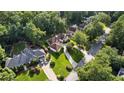 Aerial view of the property showing its location among mature trees at 2050 Trotters Ridge Way, Roswell, GA 30075