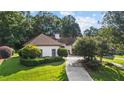 Beautifully landscaped front yard with mature landscaping at 2050 Trotters Ridge Way, Roswell, GA 30075