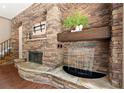 Stacked stone fireplace with waterfall feature and decorative mantel at 1065 Beacon Hill Xing, Alpharetta, GA 30005
