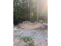 Backyard fire pit area with seating at 255 Emerald Pointe Dr, Carrollton, GA 30116
