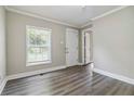 A bright entryway with modern gray wood flooring and ample natural light at 971 Sims Nw Ave, Atlanta, GA 30318