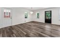 Cozy living space featuring luxury vinyl floors, lots of light and entry to backyard at 1978 Ethel Ln, Decatur, GA 30032