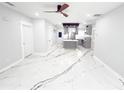 Spacious living room featuring bright, modern finishes and an open concept view of the kitchen at 2526 Center Nw St, Atlanta, GA 30318