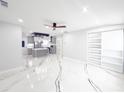 Bright, open-concept living space with modern accents, recessed lighting, and stylish built-in shelving at 2526 Center Nw St, Atlanta, GA 30318