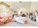 Bright bedroom with a study desk, cozy decor, and ensuite bathroom entrance at 27 Riverview Trl, Euharlee, GA 30145