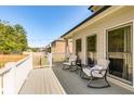 Relaxing outdoor deck space perfect for entertaining, with chairs and string lights at 27 Riverview Trl, Euharlee, GA 30145