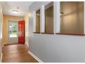 Bright entryway with red front door, wood-look floors, and yellow accents at 3105 Sumac Dr, Atlanta, GA 30360
