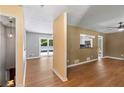 Open living space featuring hardwood floors, large windows, and access to a deck and kitchen at 3105 Sumac Dr, Atlanta, GA 30360