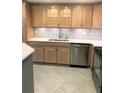 Bright kitchen with stainless steel appliances, tile flooring, and elegant white countertops at 1130 Piedmont Ne Ave # 404, Atlanta, GA 30309